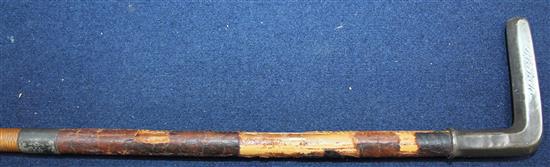 A late 19th / early 20th century riding crop, the carved ivory handle modelled as a jockeys head,